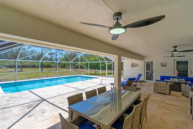 outdoor pool with ceiling fan, a patio area, an outdoor hangout area, and a lanai