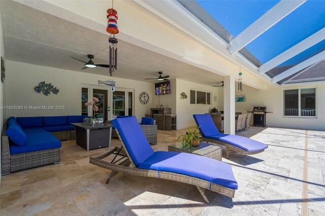 view of patio with a grill, an outdoor hangout area, and ceiling fan