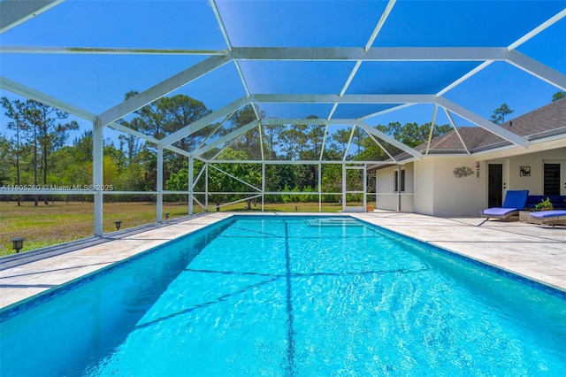 swimming pool with a patio and a lanai