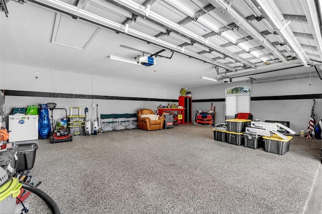 garage featuring a garage door opener