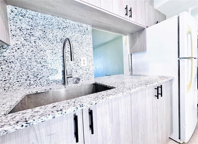 1701 NE 191st St Unit A108, Miami, FL 33179 - kitchen with light stone countertops and a sink