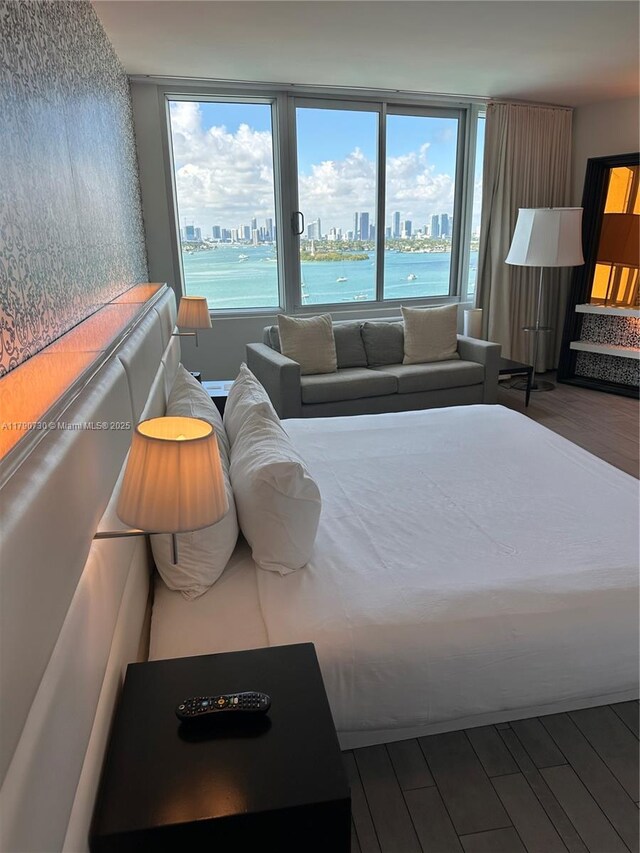 1100 W Ave Unit 1206, Miami Beach, FL 33139 - bedroom featuring a view of city and wood finished floors