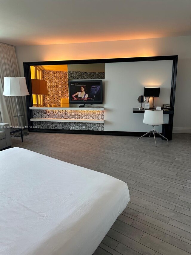 1100 W Ave Unit 1206, Miami Beach, FL 33139 - bedroom featuring wood finished floors and baseboards