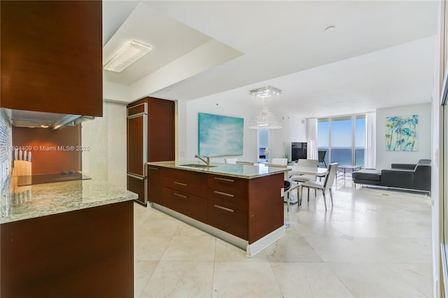 1830 S Ocean Dr Unit 3804, Hallandale Beach, FL 33009 - kitchen with black electric stovetop, a sink, open floor plan, modern cabinets, and pendant lighting