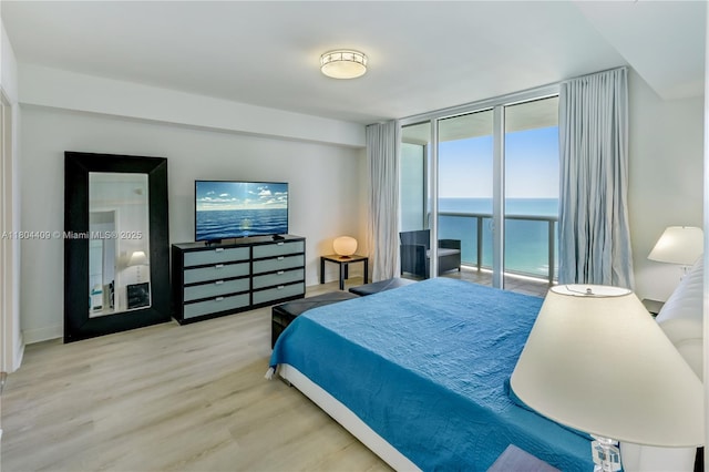 1830 S Ocean Dr Unit 3804, Hallandale Beach, FL 33009 - bedroom featuring access to outside, wood finished floors, and a wall of windows