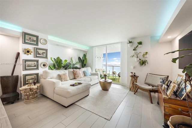 2101 Brickell Ave Unit 807, Miami, FL 33129 - living room with expansive windows and light wood-style floors