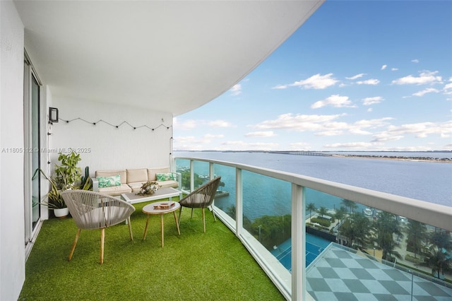 2101 Brickell Ave Unit 807, Miami, FL 33129 - balcony featuring a water view and an outdoor hangout area