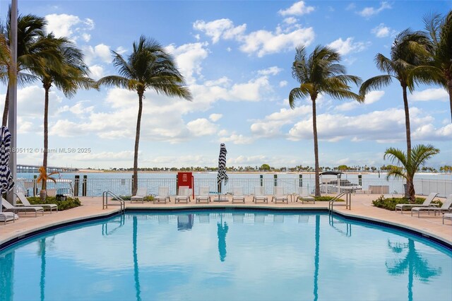 2101 Brickell Ave Unit 807, Miami, FL 33129 - community pool with fence, a patio area, and a water view