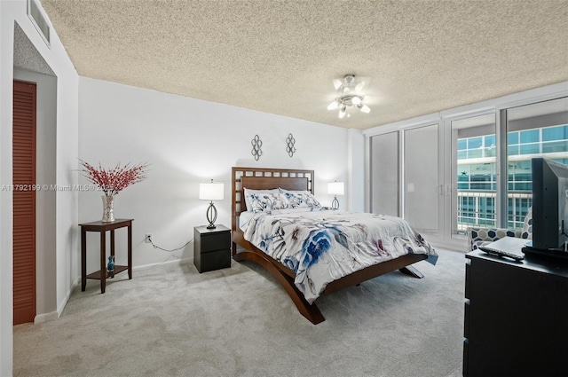 9341 Collins Ave Unit 1204, Surfside, FL 33154 - bedroom with carpet, a textured ceiling, access to exterior, and baseboards