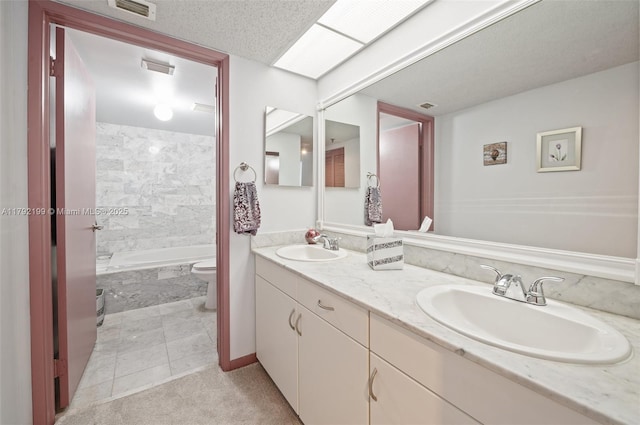 9341 Collins Ave Unit 1204, Surfside, FL 33154 - full bath featuring toilet, double vanity, tile patterned floors, and shower / tub combination