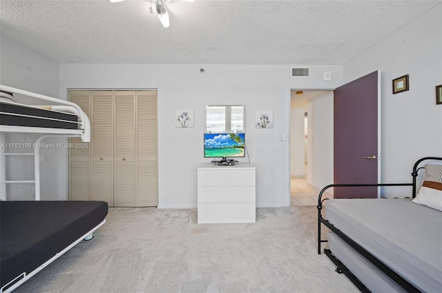 9341 Collins Ave Unit 1204, Surfside, FL 33154 - bedroom featuring carpet, a textured ceiling, and a closet