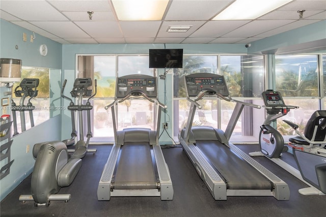 9341 Collins Ave Unit 1204, Surfside, FL 33154 - workout area with a paneled ceiling