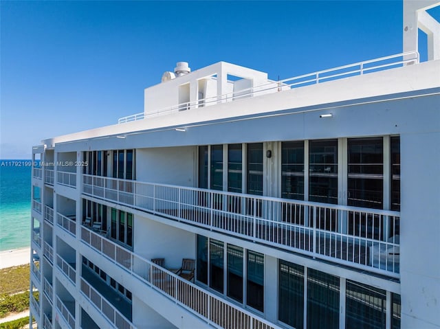 9341 Collins Ave Unit 1204, Surfside, FL 33154 - view of building exterior with a water view