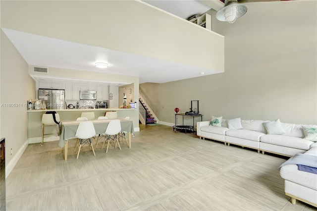 1033 NW 124th Ave, Pembroke Pines, FL 33026 - dining area with stairs and baseboards