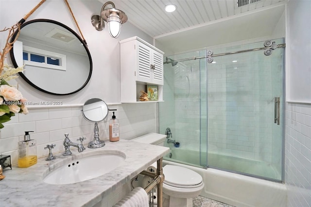 1033 NW 124th Ave, Pembroke Pines, FL 33026 - full bath featuring tile walls, combined bath / shower with glass door, toilet, and vanity