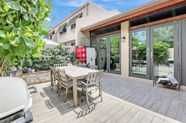 1033 NW 124th Ave, Pembroke Pines, FL 33026 - wooden terrace featuring outdoor dining space and french doors