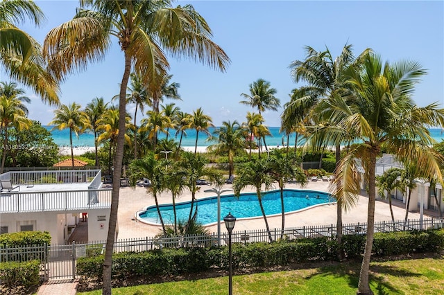 2655 Collins Ave Unit 411, Miami Beach, FL 33140 - community pool featuring fence, a patio area, and a water view