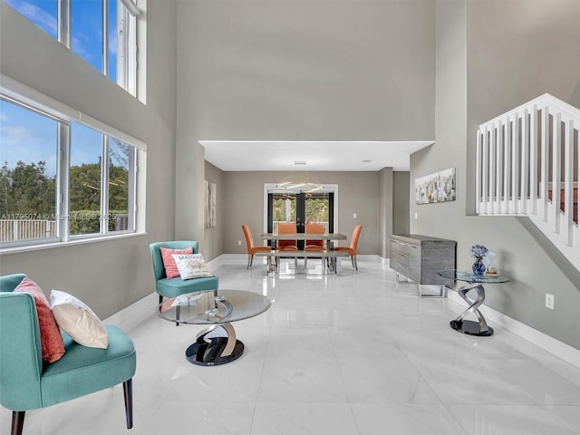 15066 SW 38th Ter, Miami, FL 33185 - living area with a high ceiling, marble finish floors, and baseboards