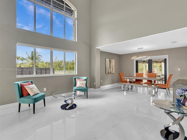 15066 SW 38th Ter, Miami, FL 33185 - sitting room featuring baseboards and a towering ceiling