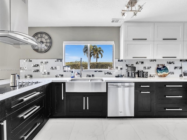 15066 SW 38th Ter, Miami, FL 33185 - kitchen with dishwasher, wall chimney exhaust hood, dark cabinetry, black electric cooktop, and a textured ceiling