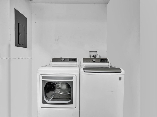 15066 SW 38th Ter, Miami, FL 33185 - laundry area with electric panel and washing machine and dryer