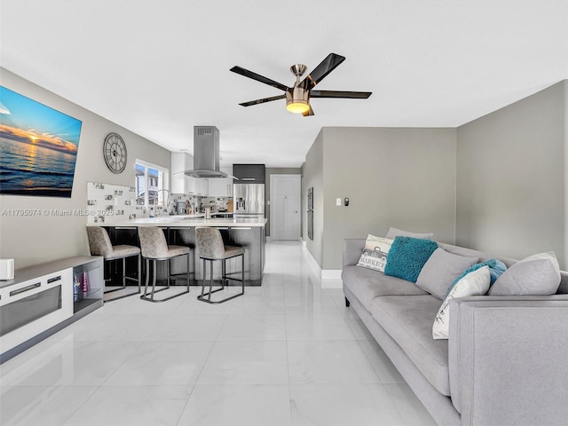 15066 SW 38th Ter, Miami, FL 33185 - living room featuring light marble finish flooring, ceiling fan, and baseboards