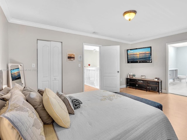 15066 SW 38th Ter, Miami, FL 33185 - bedroom with crown molding, wood finished floors, ensuite bath, a closet, and baseboards