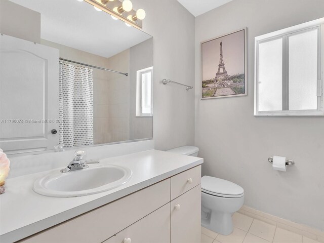 15066 SW 38th Ter, Miami, FL 33185 - full bath featuring toilet, tile patterned floors, vanity, a shower with curtain, and baseboards