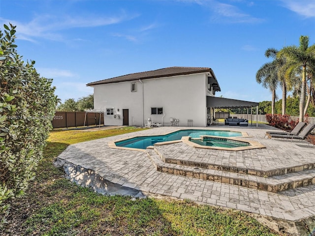 15066 SW 38th Ter, Miami, FL 33185 - view of pool with a patio, a fenced backyard, outdoor lounge area, and a pool with connected hot tub