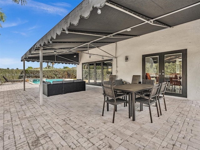 15066 SW 38th Ter, Miami, FL 33185 - view of patio / terrace with french doors, fence, and outdoor dining space