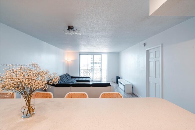 1817 S Ocean Dr Unit 0918, Hallandale Beach, FL 33009 - dining room with a textured ceiling and wood finished floors