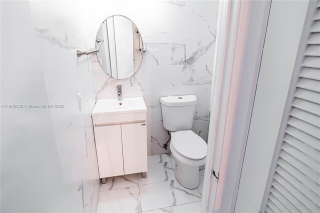 1817 S Ocean Dr Unit 0918, Hallandale Beach, FL 33009 - bathroom featuring marble finish floors, toilet, and vanity