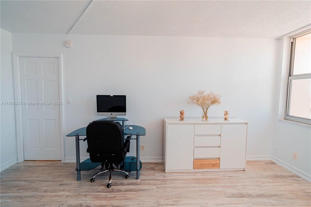 1817 S Ocean Dr Unit 0918, Hallandale Beach, FL 33009 - office area featuring light wood-type flooring, a textured ceiling, and baseboards