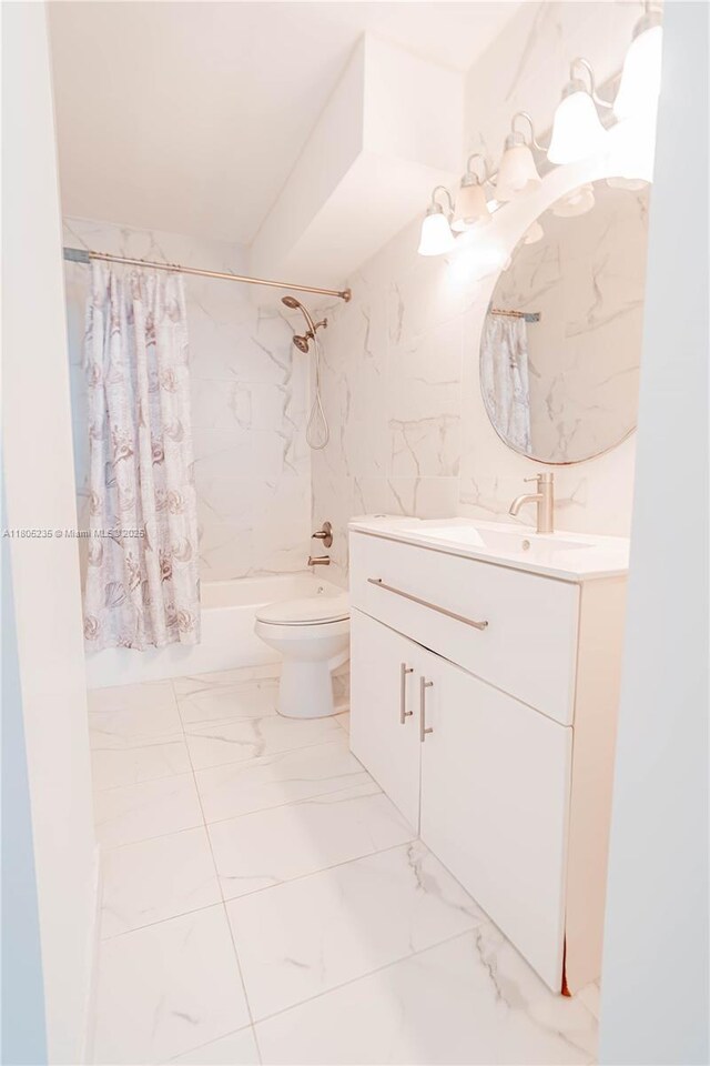 1817 S Ocean Dr Unit 0918, Hallandale Beach, FL 33009 - bathroom featuring marble finish flooring, vanity, toilet, and shower / tub combo