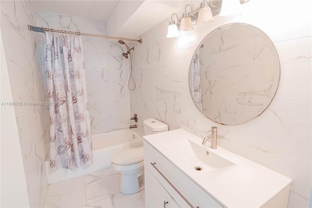 1817 S Ocean Dr Unit 0918, Hallandale Beach, FL 33009 - bathroom featuring shower / tub combo, marble finish floors, toilet, tile walls, and vanity