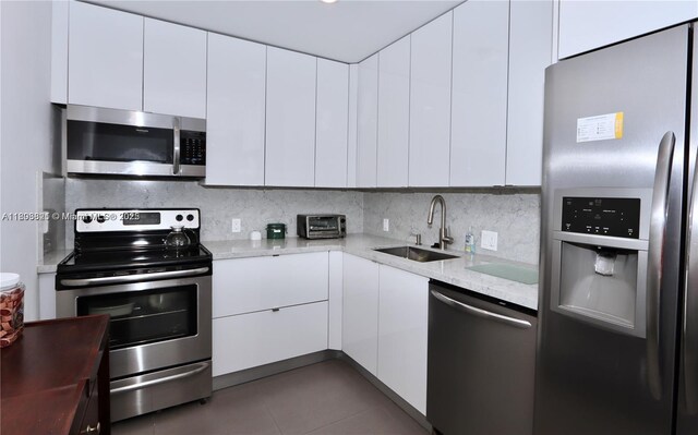20379 W Country Club Dr Unit 836, Aventura, FL 33180 - kitchen featuring appliances with stainless steel finishes, modern cabinets, a sink, and white cabinets