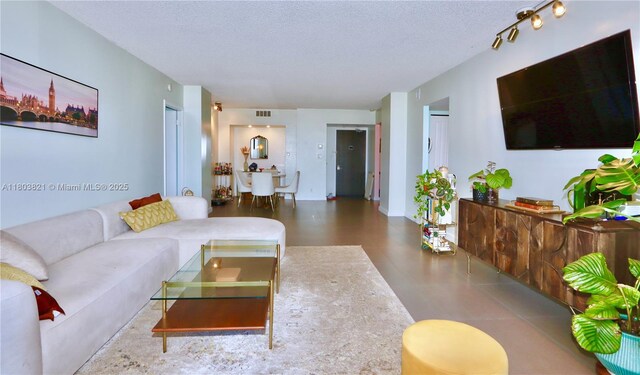 20379 W Country Club Dr Unit 836, Aventura, FL 33180 - living room featuring a textured ceiling
