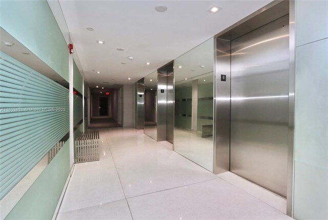 20379 W Country Club Dr Unit 836, Aventura, FL 33180 - hallway featuring elevator, light tile patterned flooring, and recessed lighting