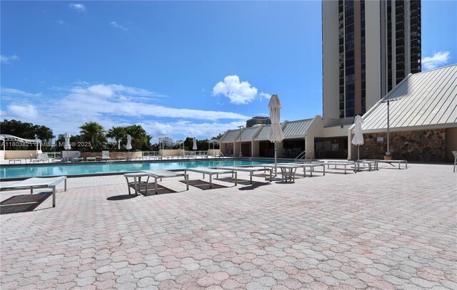 20379 W Country Club Dr Unit 836, Aventura, FL 33180 - community pool featuring a patio area