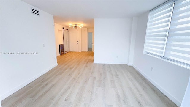 701 Collins Ave Unit 1F, Miami Beach, FL 33139 - spare room with light wood-type flooring and healthy amount of natural light