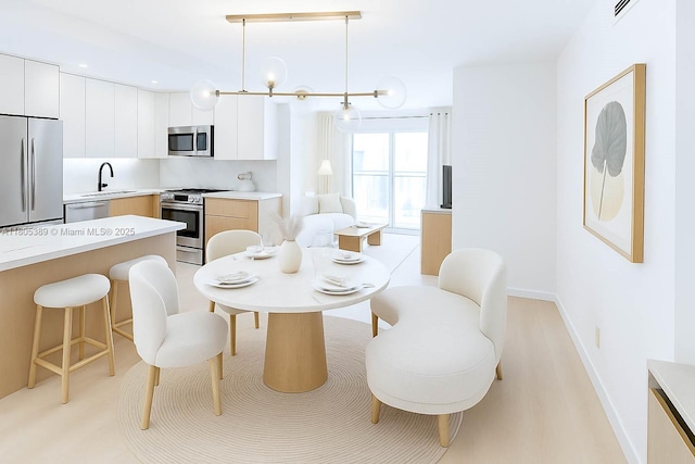 701 Collins Ave Unit 1F, Miami Beach, FL 33139 - dining room featuring baseboards