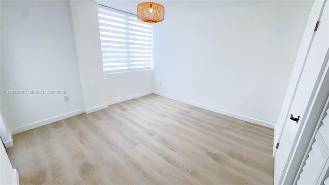 701 Collins Ave Unit 1F, Miami Beach, FL 33139 - empty room with wood finished floors and baseboards