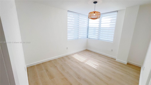 701 Collins Ave Unit 1F, Miami Beach, FL 33139 - unfurnished room with light wood-type flooring and baseboards