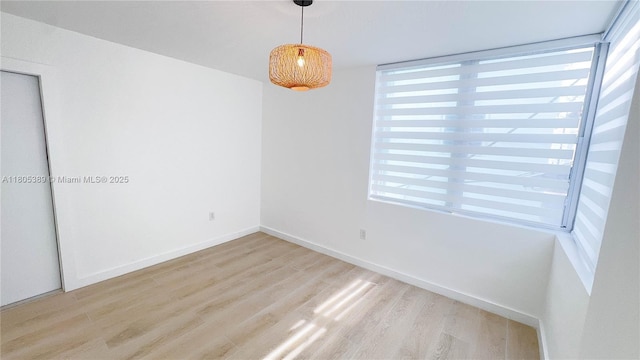 701 Collins Ave Unit 1F, Miami Beach, FL 33139 - unfurnished room with wood finished floors and plenty of natural light