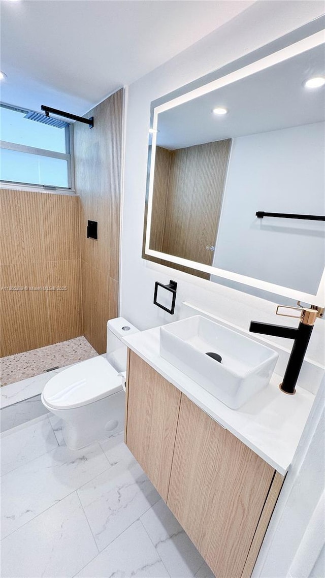 701 Collins Ave Unit 1F, Miami Beach, FL 33139 - bathroom featuring vanity, a shower stall, marble look tile flooring, and recessed lighting