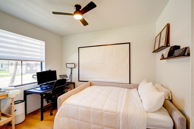 10602 W 33rd Way, Hialeah, FL 33018 - bedroom with wood finished floors and a ceiling fan