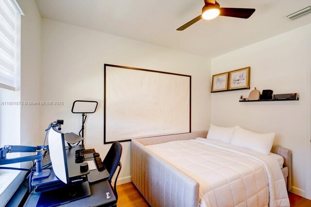 10602 W 33rd Way, Hialeah, FL 33018 - bedroom with wood finished floors, baseboards, and ceiling fan