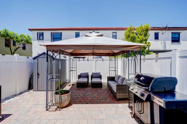 10602 W 33rd Way, Hialeah, FL 33018 - fenced backyard with a gazebo, a patio area, an outdoor living space, and area for grilling