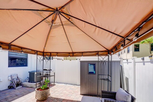 10602 W 33rd Way, Hialeah, FL 33018 - fenced backyard with a gazebo, central AC unit, and a patio area