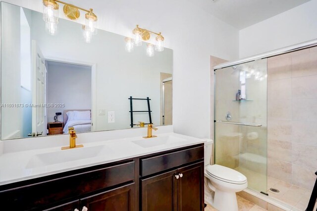 10602 W 33rd Way, Hialeah, FL 33018 - bathroom with connected bathroom, a stall shower, double vanity, and toilet